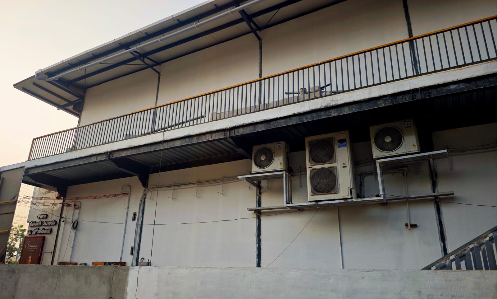 Residential building facade with balcony and air conditioning units