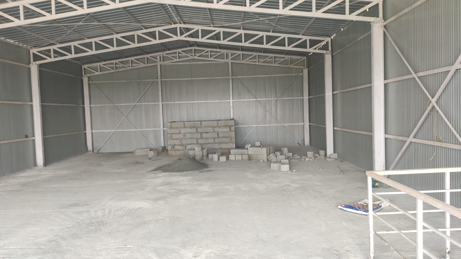 Steel frame floor structure under construction with city backdrop