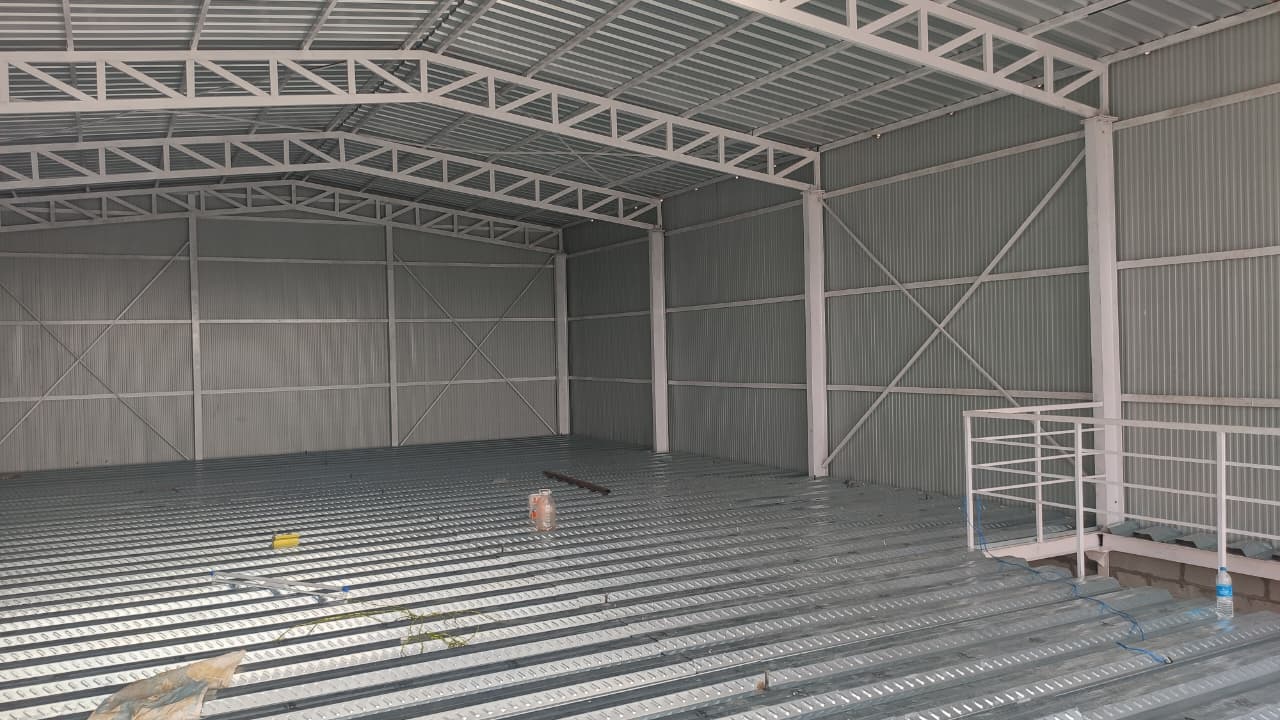 Steel-framed warehouse interior nearing completion